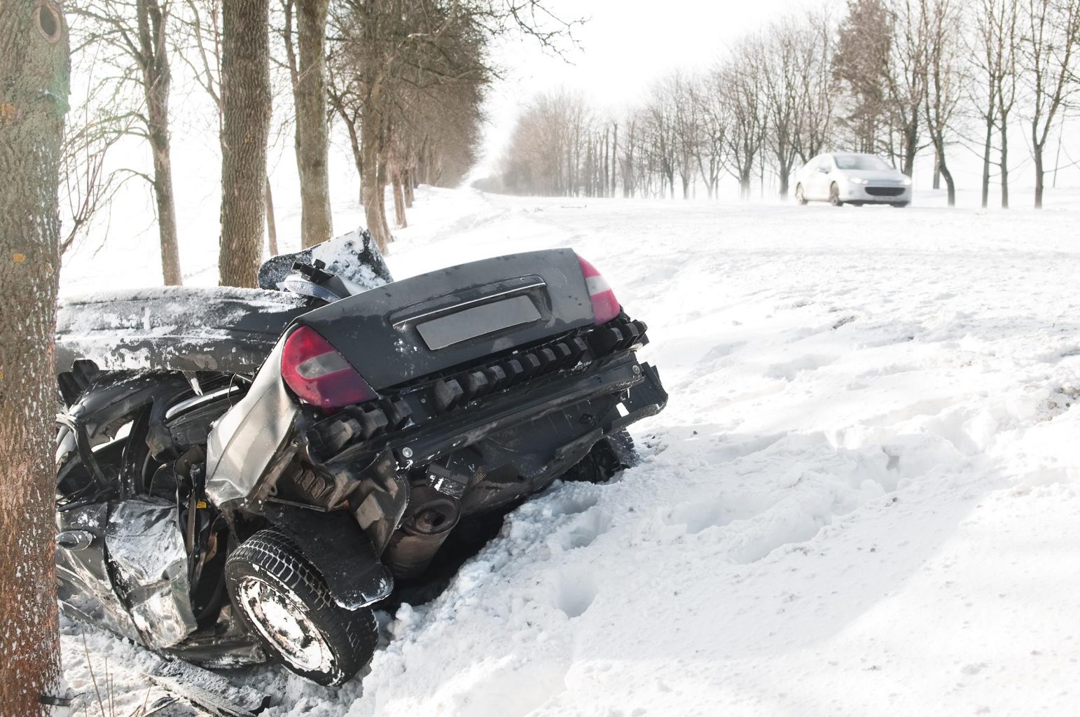 Car in snowbank following head-on collision