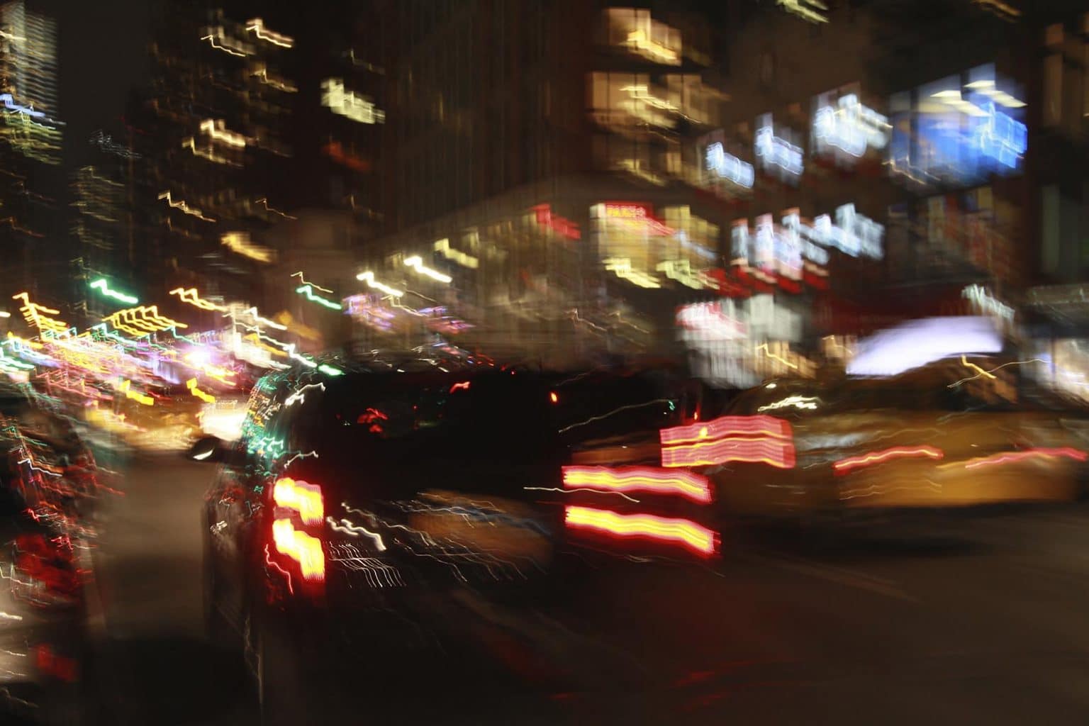 Evening traffic showing blurred vision of driver due to alcohol inebriation. Drunk driving is a leading cause of multi-vehicle accidents. Be sure you have a multi-vehicle accident lawyer protecting your interests.