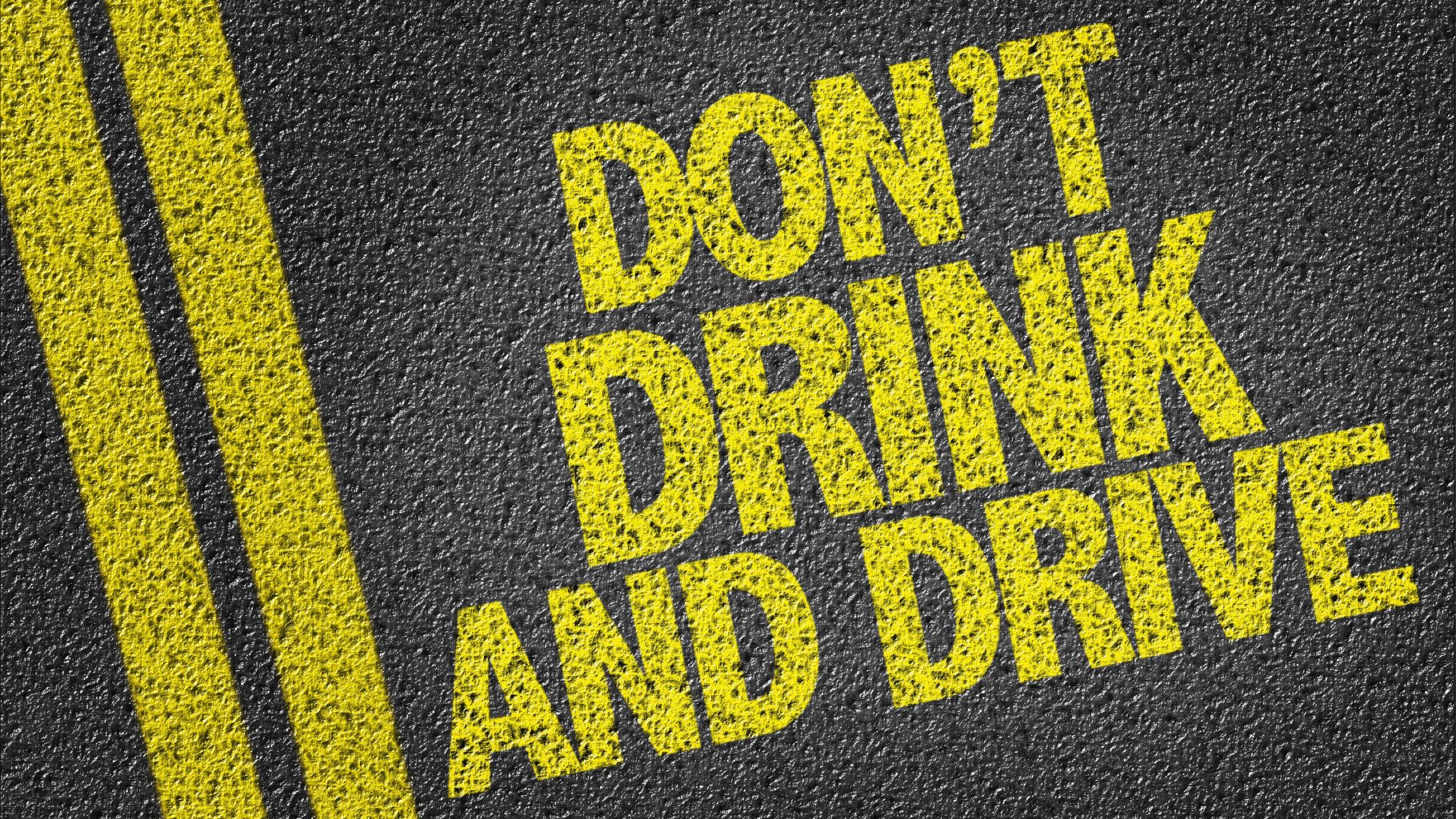 Don't Drink and Drive printed on paved road, a warning to prevent drunk driver accidents. Victims of drunk drivers should call a personal injury lawyer (drunk driver accident lawyer) to protect their interests and gain the maximum compensation possible. Joseph A. Nagy Injury Law represents the injury victims of drunk drivers.