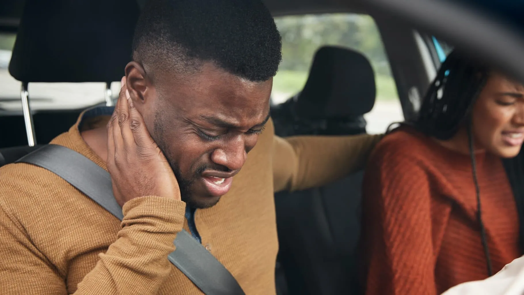 Passenger Accidents - Car passenger accident with focus on male passenger injured, possible whiplash injury. Talk with an experienced passenger accidents lawyer to make sure you are treated fairly by the insurance companies.