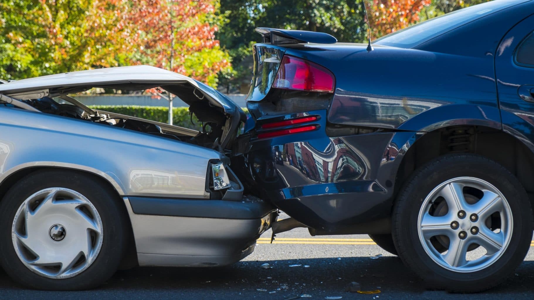 Two cars involved in a rear end accident. Injuries from rear end accidents can be severe and include chronic pain. Call a qualified personal injury lawyer with experience handling rear end accident claims.